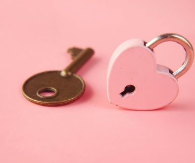 A key with a heart-shaped lock, symbolizing self-love, empowerment, and thriving as a single individual.