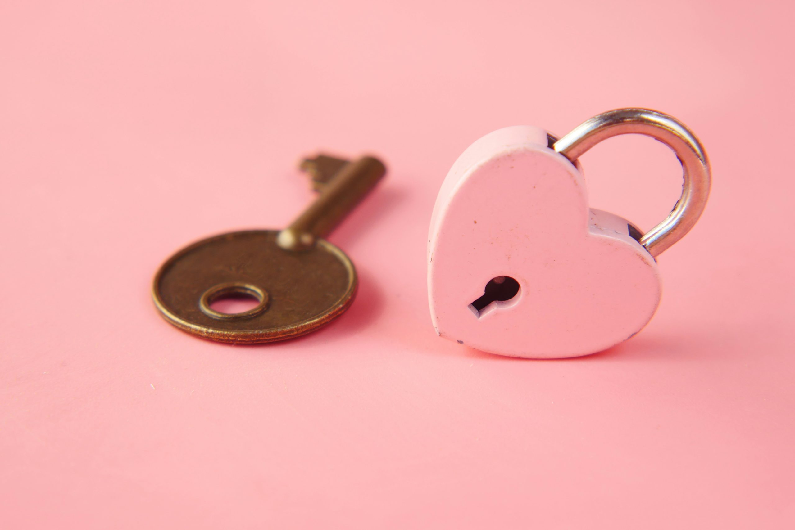 A key with a heart-shaped lock, symbolizing self-love, empowerment, and thriving as a single individual.