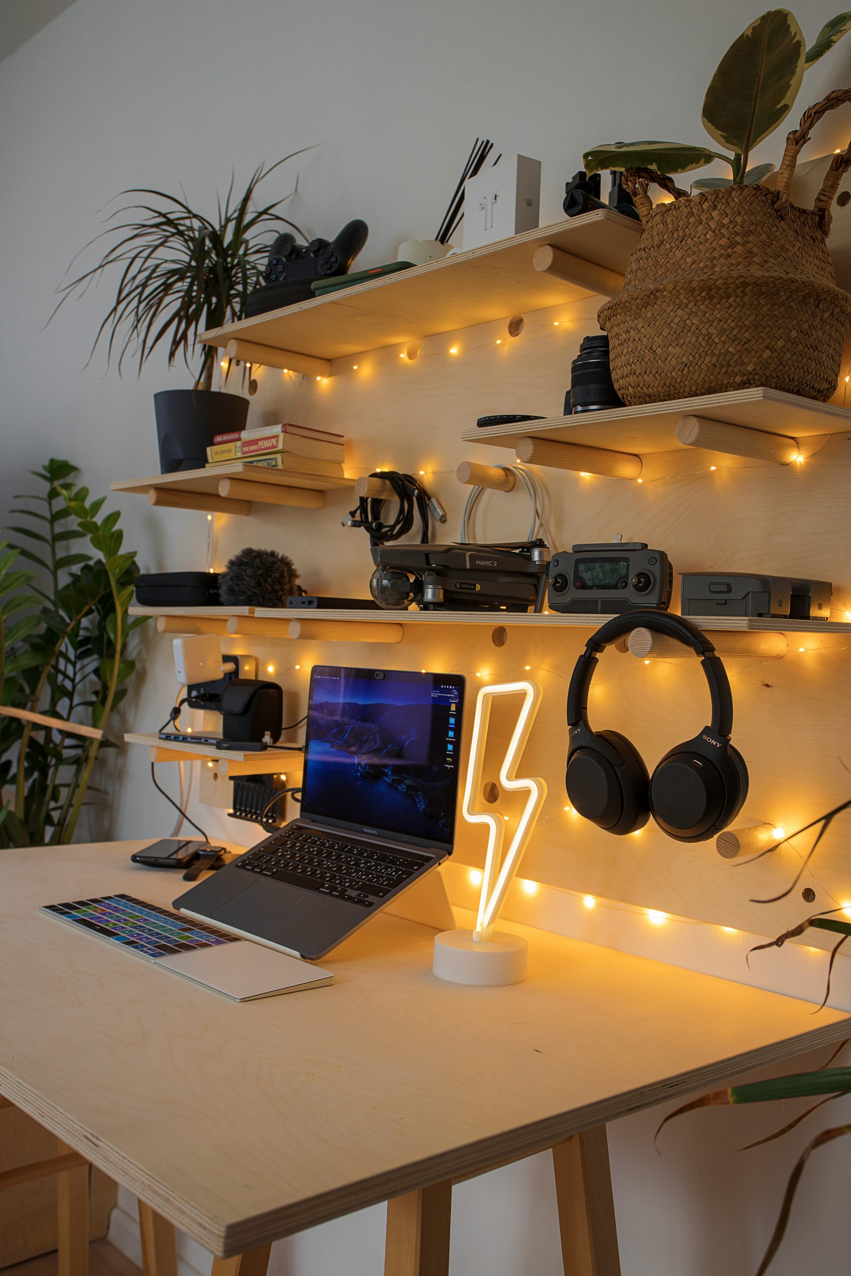  Artistic desk with headphones and a laptop, representing the use of music for inspiration. 