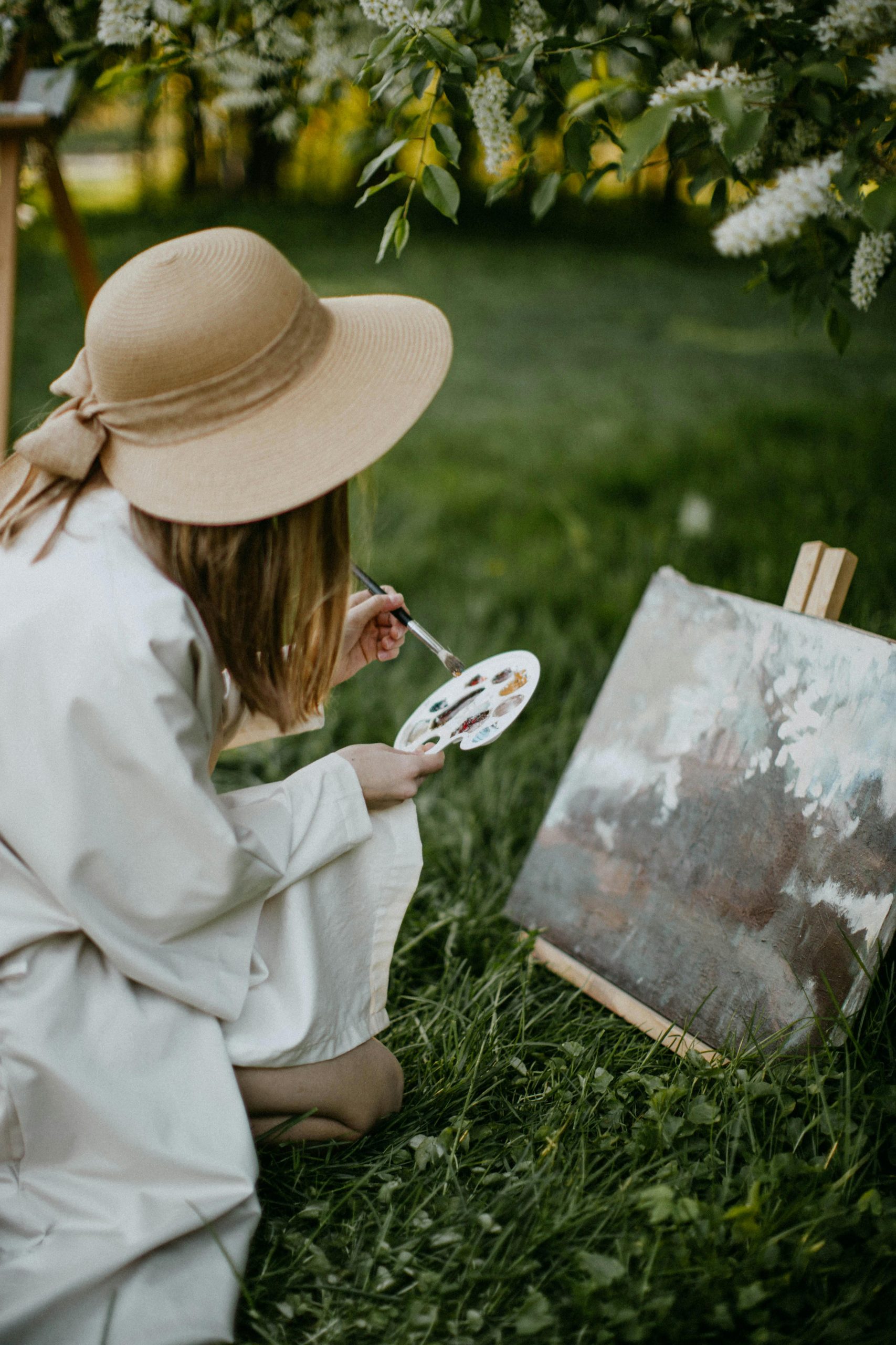 A woman sketching outdoors, surrounded by nature, symbolizing creativity as a mental escape.