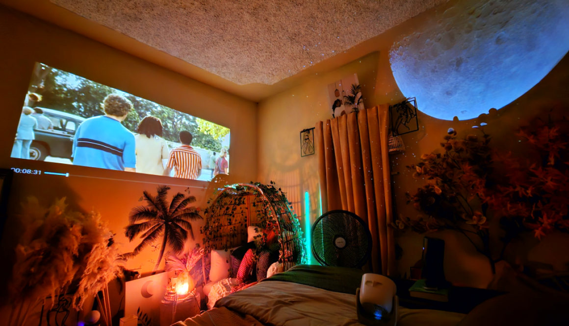 me watching a movie with my projector for a cozy home cinema experience.